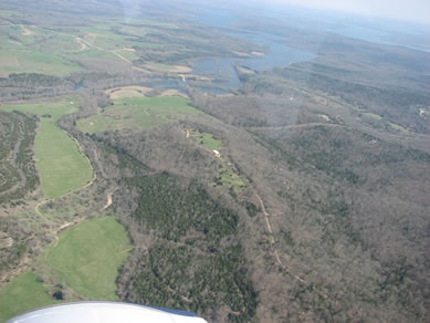 All known cave passages underlie the ridge in the center of this photo